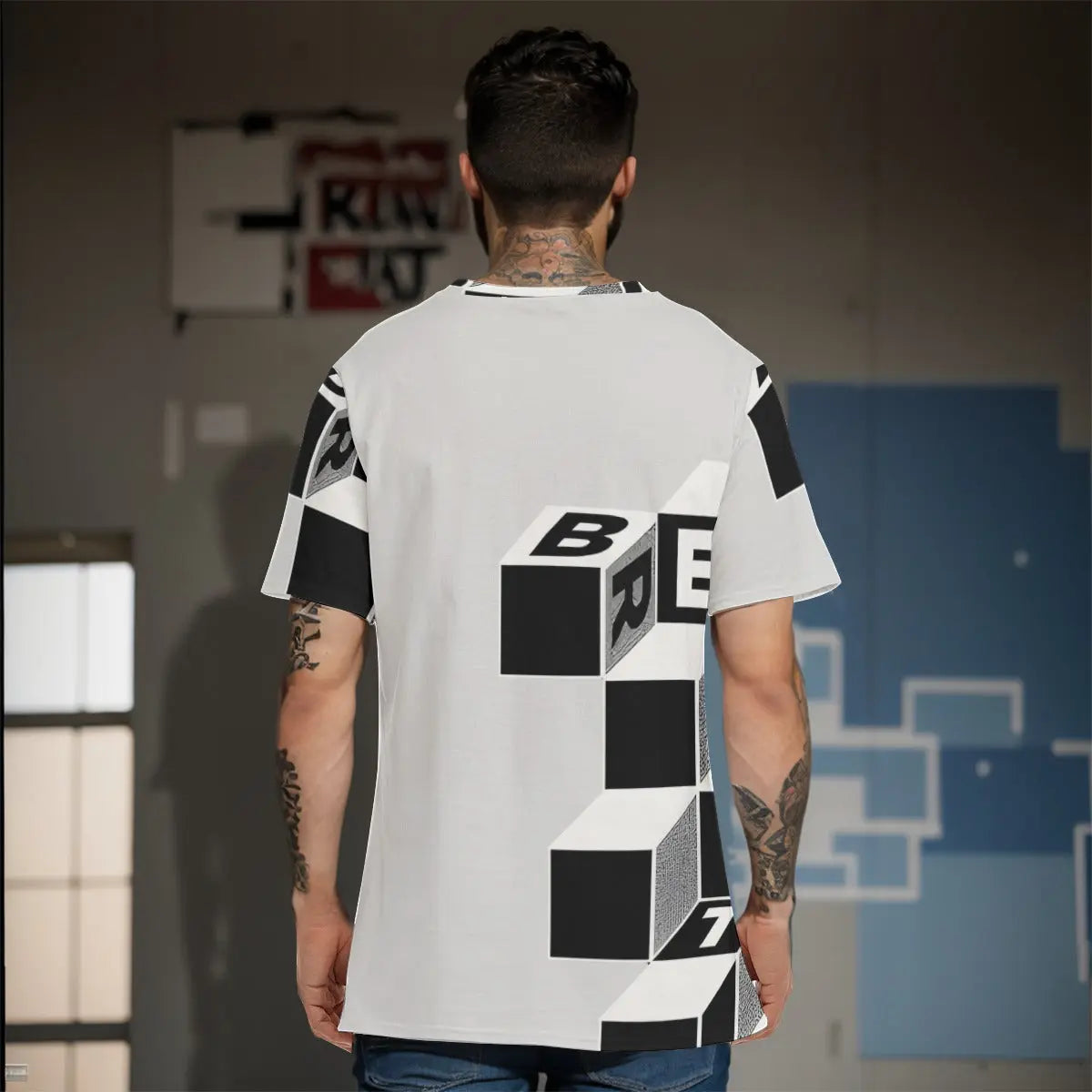 Back view of a man wearing a graphic men's cotton T-shirt with a 3D cube design in black and white, showcasing the tee's stylish look.