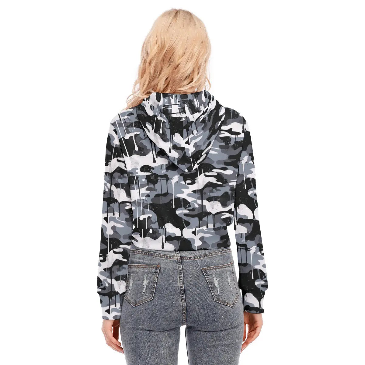 Back view of a woman wearing a camo cropped jacket with hood, paired with jeans, highlighting fashion and style.