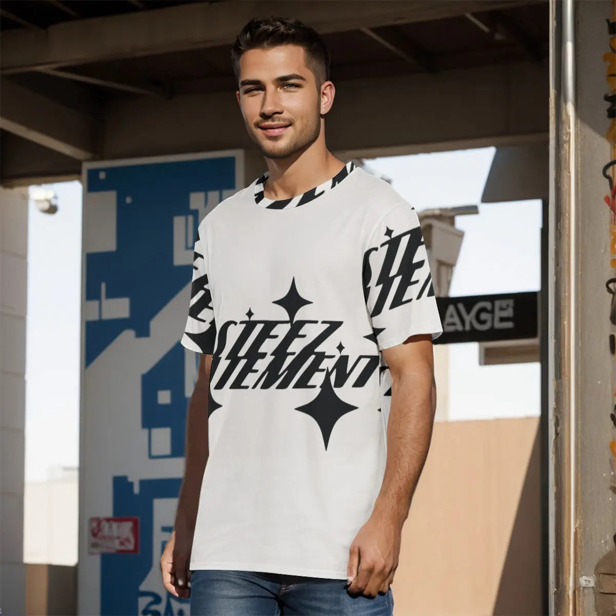 Man wearing a stylish graphic T-shirt with bold print, standing outdoors in casual jeans, showcasing modern and trendy men's fashion.