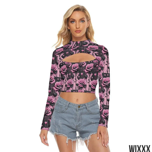 Woman wearing a black and pink hollow chest crop top with floral design paired with denim shorts, trendy and stylish look.