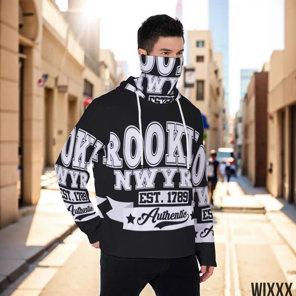 Men's masked hoodie with New York graphic, worn outdoors in urban setting, made from eco-friendly materials for sustainable fashion.