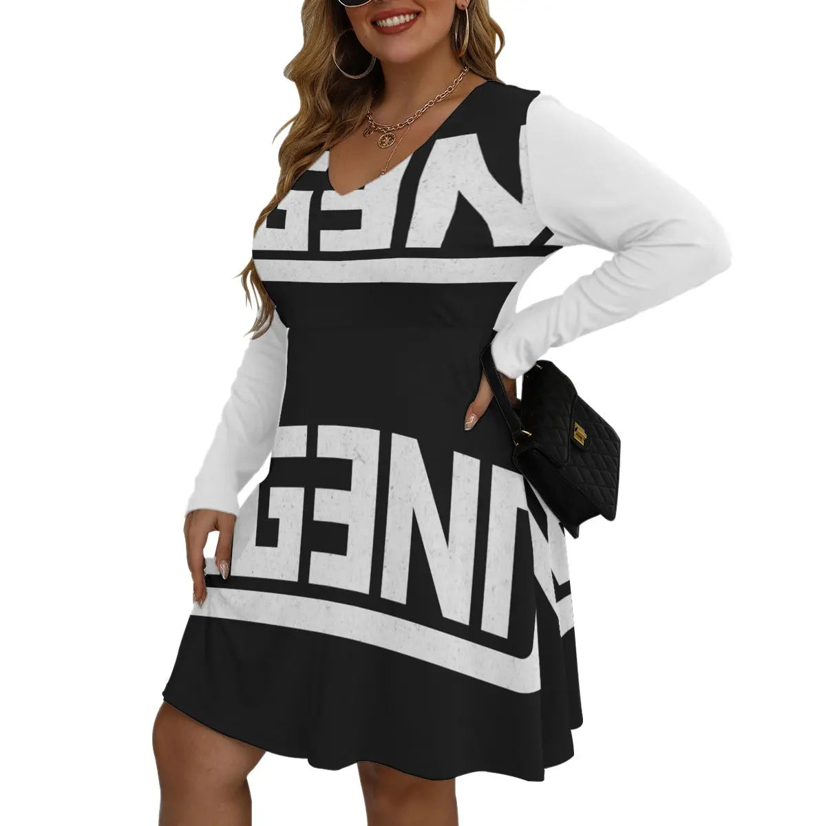 Woman wearing a V-neck Bell Dress with long sleeves and bold graphic design, holding a purse