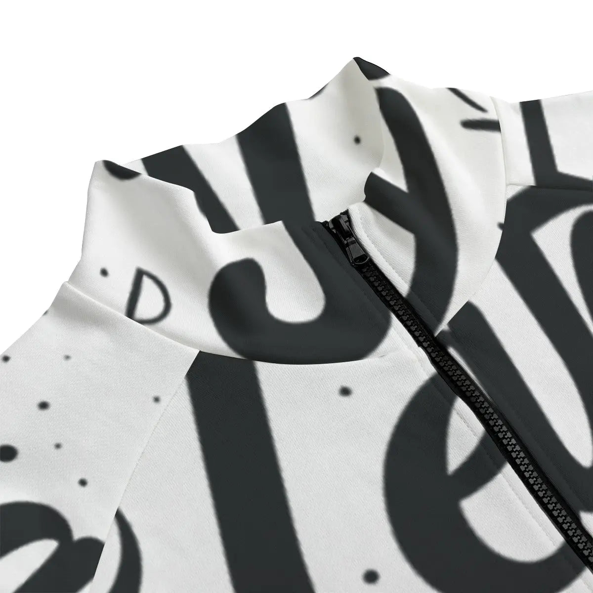 Close-up of a cotton bomber jacket with a zip-up front, stylish black and white graphic print, and stand-up collar.