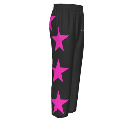Black tracksuit pants with pink star design, featuring elastic waistband and side pockets for comfortable sports or leisure wear.