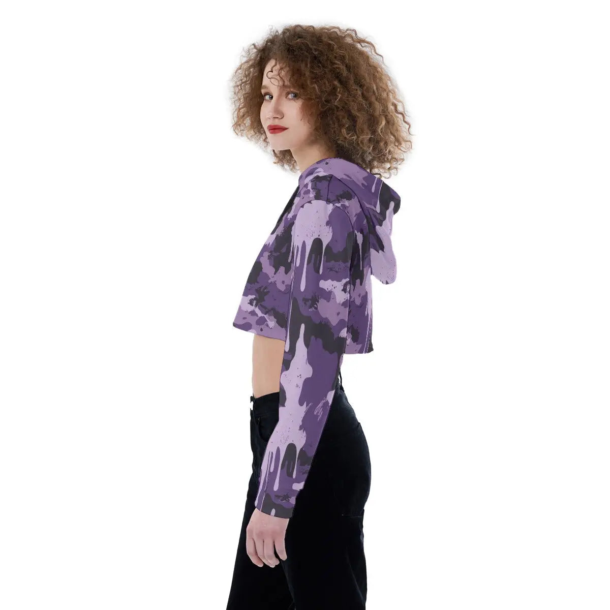 Side view of a woman wearing a purple camouflage cropped hoodie with long sleeves and drawstring hood, suitable for casual wear.