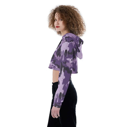 Side view of a woman wearing a purple camouflage cropped hoodie with long sleeves and drawstring hood, suitable for casual wear.