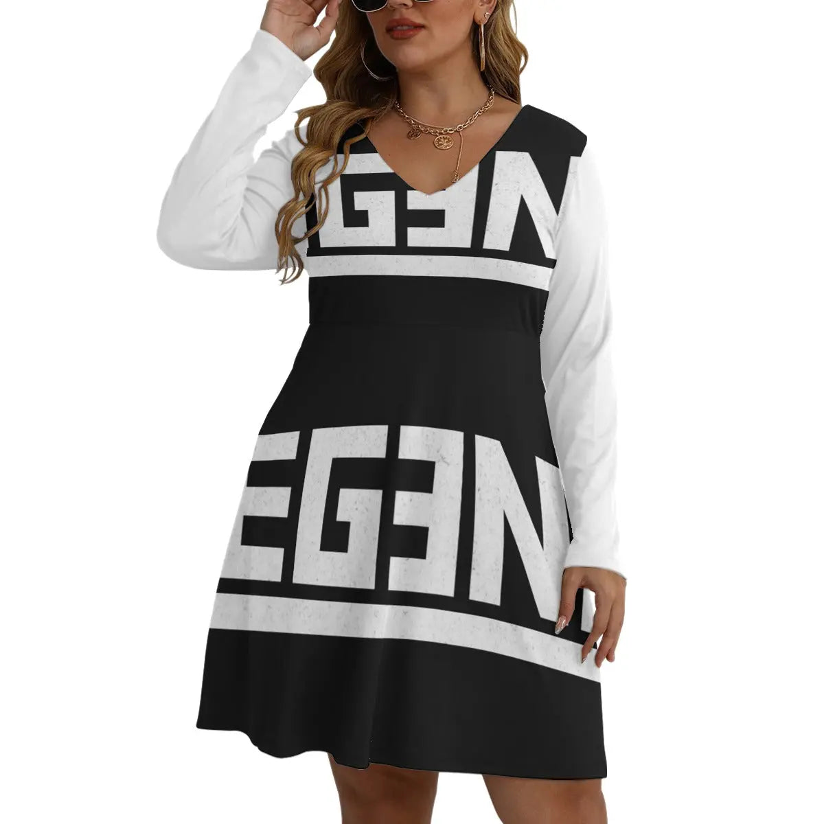 Woman wearing V-neck Bell Dress with long sleeves, featuring bold black and white graphic design, available in sizes L to 5XL.