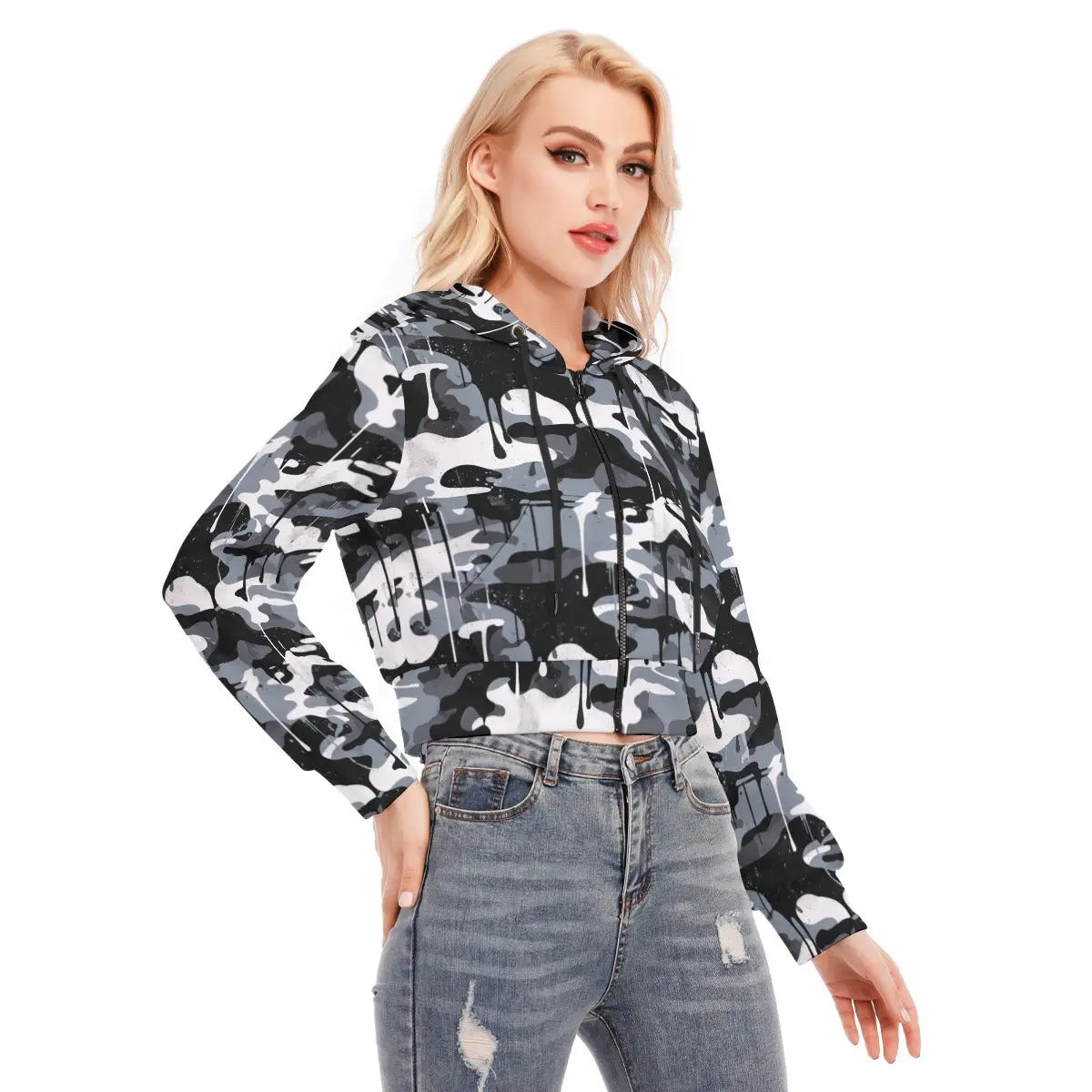 Woman wearing a camo-patterned cropped jacket with zipper and long sleeves, paired with jeans. Made from scuba fabric, available in XS-2XL.