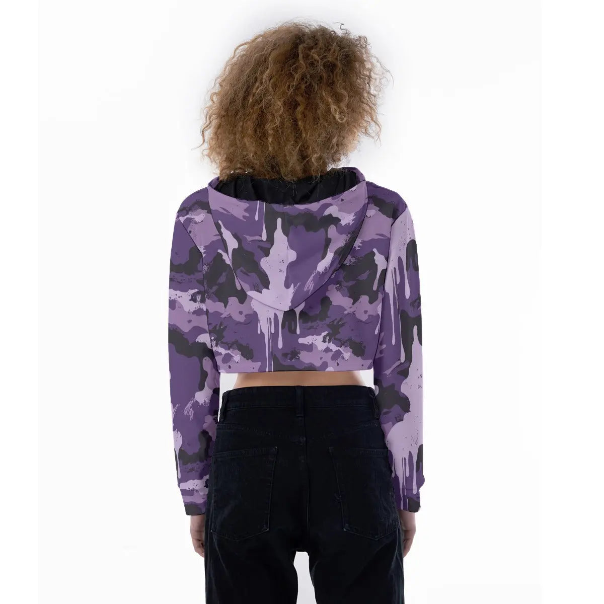 Back view of woman wearing a purple camo cropped hoodie with long sleeves and drawstring hood. Casual fashion for school or sportswear.