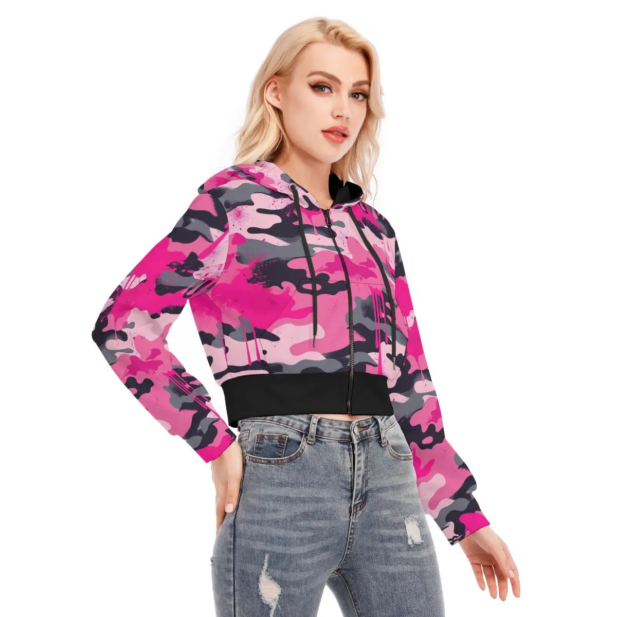 Woman wearing a pink camo cropped jacket with zipper closure, styled with jeans for a casual look.