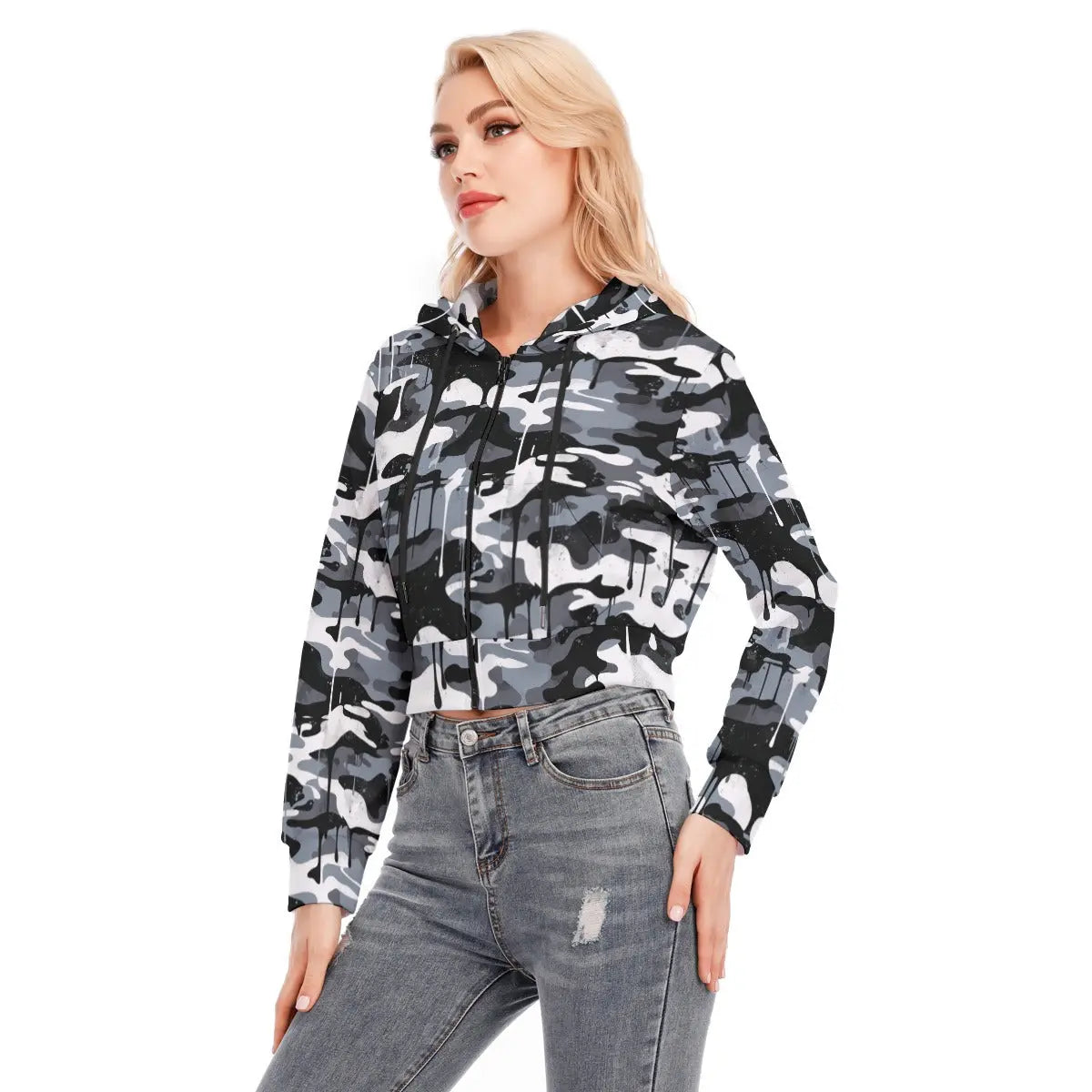 Model wearing a trendy camo cropped jacket with zipper closure, long sleeves, and paired with distressed jeans, perfect for casual outings.