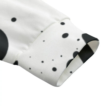 Close-up of bomber jacket sleeve with black dot pattern on white cotton fabric.