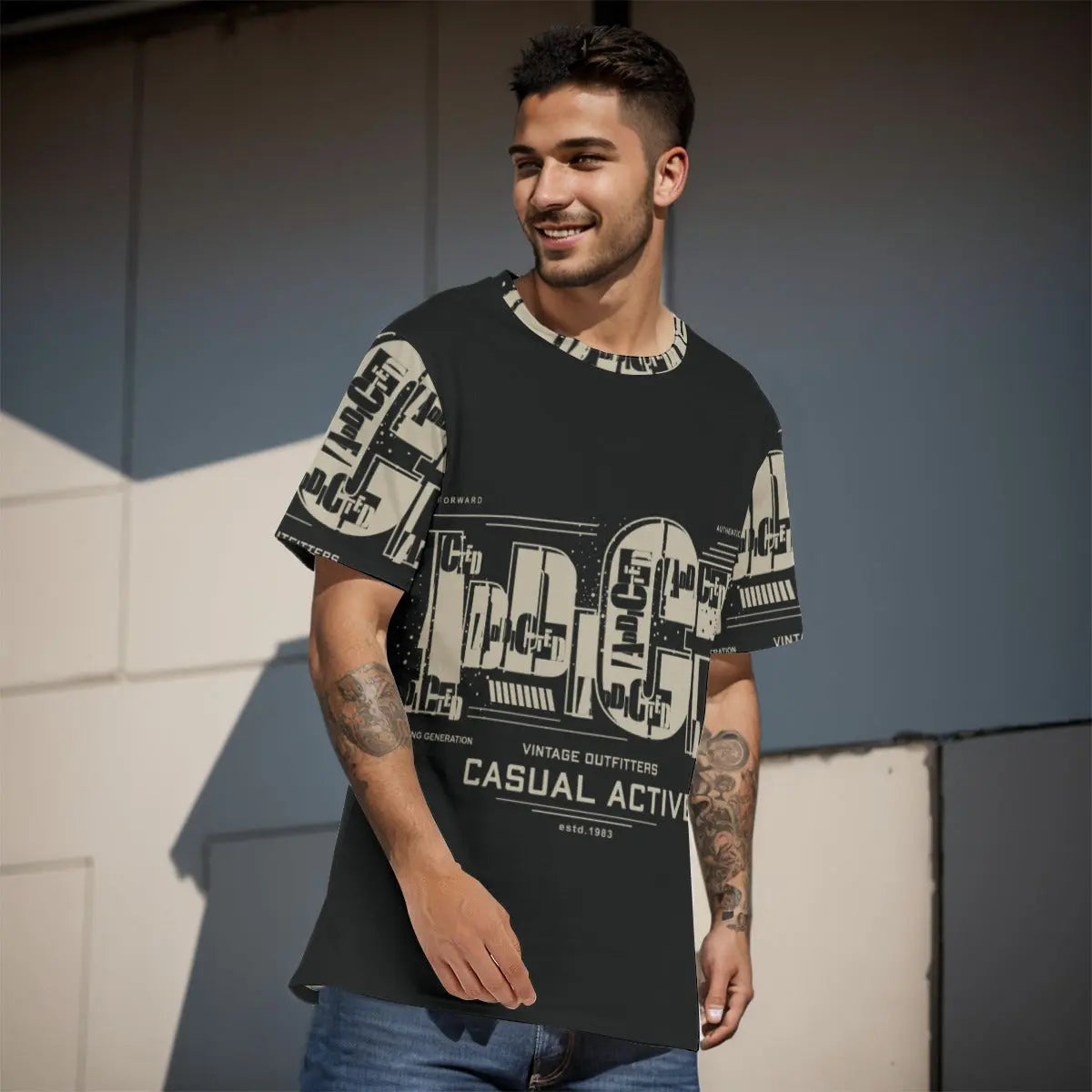 Man wearing a vintage-style printed T-shirt outdoors, smiling casually, showcasing relaxed fashion for everyday wear.