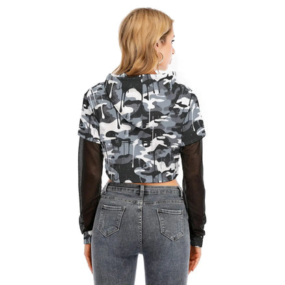 Back view of a woman wearing a camo layered crop top with mesh sleeves and hoodie, paired with jeans.