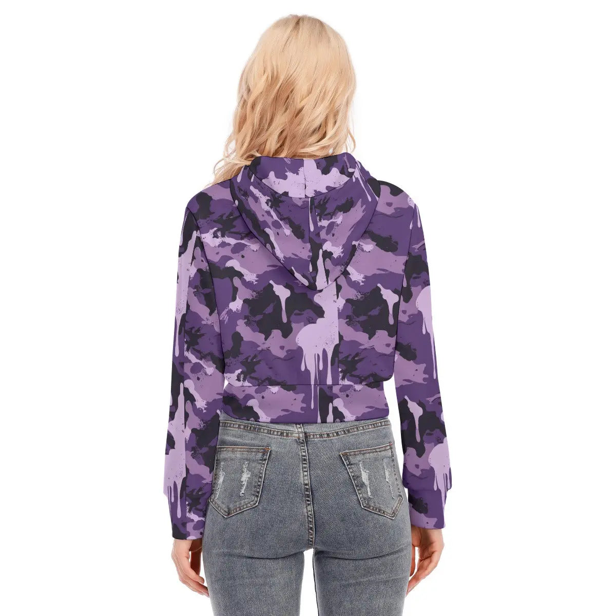 Back view of a woman wearing a purple camo cropped jacket with long sleeves and a hood, paired with blue jeans.