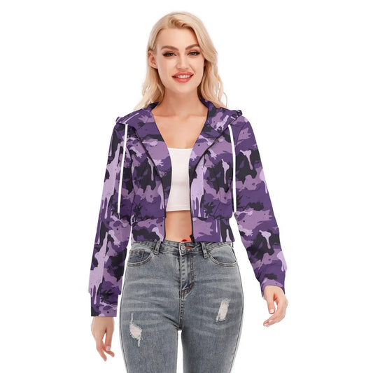 Model wearing a purple camo cropped jacket with zipper closure, paired with blue jeans. Casual fashion outfit.